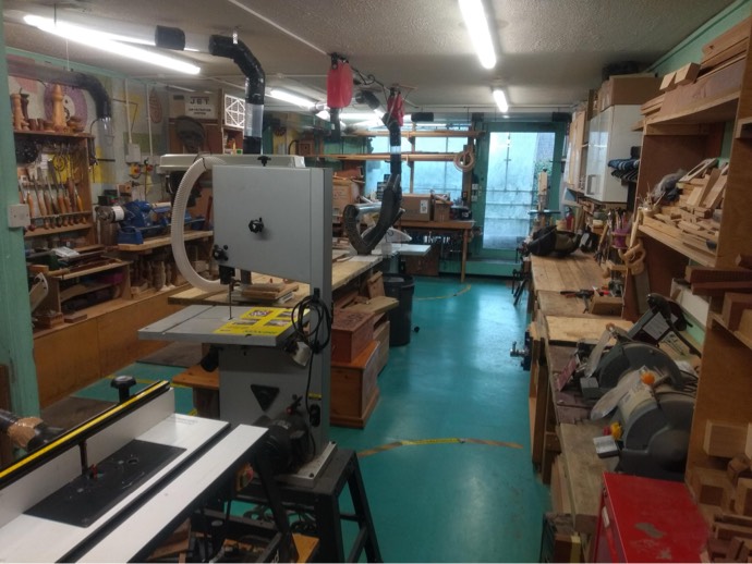 Photo of the inside of the workshop, showing various woodworking machines
